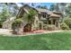 Brick home with stone accents and a manicured lawn at 6729 Greywalls Ln, Raleigh, NC 27614