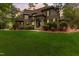 Brick house with stone accents, a large yard, and a three-car garage at 6729 Greywalls Ln, Raleigh, NC 27614