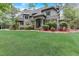Two-story brick home with stone accents and a lush lawn at 6729 Greywalls Ln, Raleigh, NC 27614