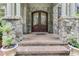 Ornate double doors and stone entryway at 6729 Greywalls Ln, Raleigh, NC 27614