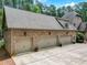 Four-car brick garage with ample parking space at 6729 Greywalls Ln, Raleigh, NC 27614