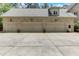 Three-car garage with large concrete driveway at 6729 Greywalls Ln, Raleigh, NC 27614