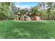 Brick house with landscaped yard and spacious lawn at 6729 Greywalls Ln, Raleigh, NC 27614