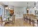 Kitchen features island with seating and hardwood floors at 6729 Greywalls Ln, Raleigh, NC 27614