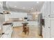 Large kitchen with stainless steel appliances, granite countertops, and hardwood floors at 6729 Greywalls Ln, Raleigh, NC 27614
