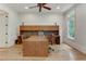 Home office with built-in cabinetry and hardwood floors at 6729 Greywalls Ln, Raleigh, NC 27614