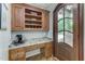 Home office with built-in cabinetry and granite countertop at 6729 Greywalls Ln, Raleigh, NC 27614