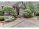 Side entrance with brick walkway and stone accents at 6729 Greywalls Ln, Raleigh, NC 27614