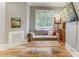 Cozy sitting area with comfortable sofa and wood floors at 6729 Greywalls Ln, Raleigh, NC 27614