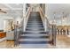 Elegant staircase with dark wood and wrought iron accents at 6729 Greywalls Ln, Raleigh, NC 27614