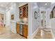 Built-in wet bar with wine rack and mini-fridge at 6729 Greywalls Ln, Raleigh, NC 27614