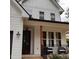 Inviting front porch with a seating area, perfect for relaxing and enjoying the outdoors at 716 Spirit Hill Dr, Hillsborough, NC 27278