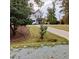 Beautiful two-story home with a well-manicured lawn and mature trees in the background at 716 Spirit Hill Dr, Hillsborough, NC 27278