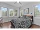 Bright bedroom with hardwood floors, large windows and a ceiling fan at 727 Martin Luther King Jr Blvd Blvd, Raleigh, NC 27601
