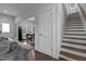 Bright hallway with hardwood floors leading to the dining area and staircase at 727 Martin Luther King Jr Blvd Blvd, Raleigh, NC 27601