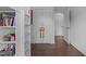 Hallway showing hardwood floors, built-in storage shelves and closet space at 727 Martin Luther King Jr Blvd Blvd, Raleigh, NC 27601
