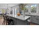Bright kitchen with large island, gray cabinetry, white countertops and stainless steel appliances at 727 Martin Luther King Jr Blvd Blvd, Raleigh, NC 27601
