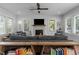 Spacious living room has a fireplace, modern ceiling fan, and open floor plan at 727 Martin Luther King Jr Blvd Blvd, Raleigh, NC 27601