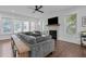 Comfortable living room with a large sectional sofa, fireplace, and multiple windows at 727 Martin Luther King Jr Blvd Blvd, Raleigh, NC 27601