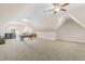 Large bonus room with neutral carpet, a pool table, bar, and ceiling fan at 7945 Parker Mill Trail, Fuquay Varina, NC 27526