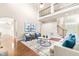 Bright and airy living room with a fireplace, hardwood floors, and comfortable seating at 7945 Parker Mill Trail, Fuquay Varina, NC 27526