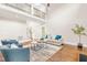 Bright living room with hardwood floors, a ceiling fan, and comfortable seating arrangement at 7945 Parker Mill Trail, Fuquay Varina, NC 27526