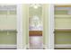 Luxurious main bathroom showcasing a walk-in shower, soaking tub, tile flooring, and ample counter space at 7945 Parker Mill Trail, Fuquay Varina, NC 27526