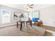 An office featuring a ceiling fan, carpet, neutral paint, and lots of natural light with adjacent stairs at 7945 Parker Mill Trail, Fuquay Varina, NC 27526