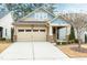 Craftsman style home with two-toned siding, stone accents, and a two-car garage at 1009 Santiago St, Durham, NC 27703