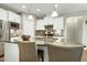 Kitchen featuring stainless steel appliances, white cabinets, and granite counters at 1009 Santiago St, Durham, NC 27703
