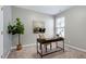 Office space with a desk, decor, natural light, and a tree in the corner at 1009 Santiago St, Durham, NC 27703