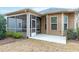 A screened porch is attached to the home and has direct access to the outdoor concrete patio area at 1009 Santiago St, Durham, NC 27703