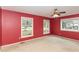Spacious bedroom with red walls and carpet at 101 Monterey Ln, Durham, NC 27713
