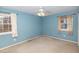 Light blue bedroom with carpet flooring and ceiling fan at 101 Monterey Ln, Durham, NC 27713
