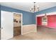 Dining room with chandelier and access to kitchen at 101 Monterey Ln, Durham, NC 27713