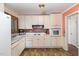 Bright kitchen with white cabinets and appliances at 101 Monterey Ln, Durham, NC 27713