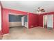 Open living room and dining room with red and blue walls at 101 Monterey Ln, Durham, NC 27713