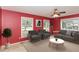 Living room with red walls and ceiling fan at 101 Monterey Ln, Durham, NC 27713