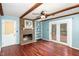 Living room with fireplace, built-ins, hardwood floors, and access to deck at 101 Monterey Ln, Durham, NC 27713