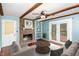Living room with fireplace, built-ins, hardwood floors, and access to deck at 101 Monterey Ln, Durham, NC 27713