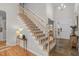 Interior view of a staircase with wooden railing and carpet at 102 Kensbury Cir, Cary, NC 27513