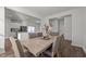 Dining room with a wood table and six chairs, open to the kitchen at 105 Kcf Dr, Elon, NC 27244