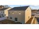 Tan two story house with a backyard at 105 Kcf Dr, Elon, NC 27244