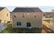 Two-story house with a backyard and sliding glass doors at 105 Kcf Dr, Elon, NC 27244