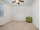 Cozy bedroom with a green accent chair and neutral decor at 105 Scoville Rd, Garner, NC 27529