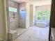 Large bathroom featuring large shower and soaking tub at 109 Evander Way, Pittsboro, NC 27312