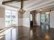 Formal dining room with hardwood floors, chandelier, and large windows at 109 Evander Way, Pittsboro, NC 27312