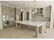 Spacious kitchen with a large island, custom cabinetry, and modern finishes at 109 Evander Way, Pittsboro, NC 27312