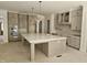 Well-appointed kitchen featuring a large island, stainless steel appliances, and custom cabinets at 109 Evander Way, Pittsboro, NC 27312
