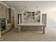 Bright, open kitchen with a central island and ample storage space at 109 Evander Way, Pittsboro, NC 27312